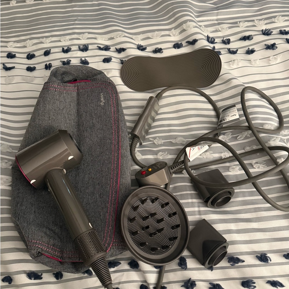 Dyson dryer with all attachments. Only used once